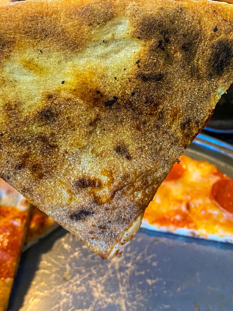 Bottom crust of a New York style pizza on the Blackstone Pizza Oven